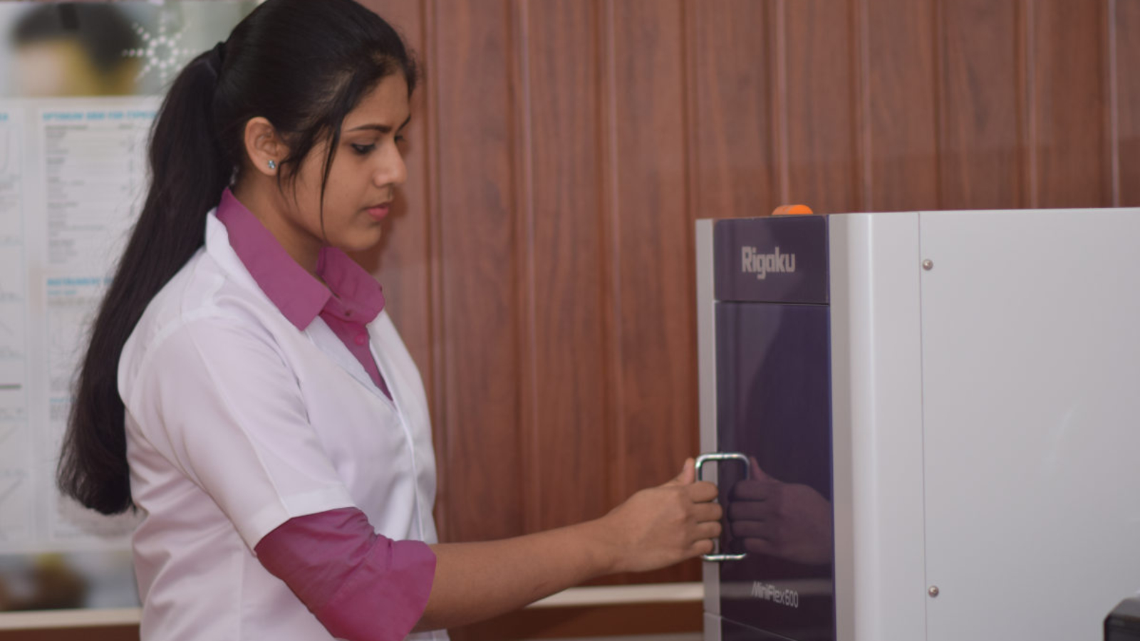 Rosemary Salin handling powder X-ray diffractometer