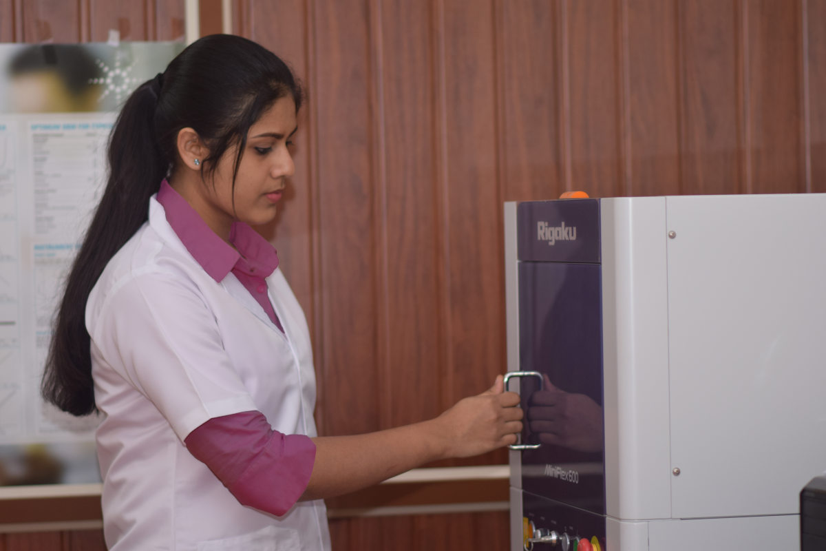 Rosemary Salin handling powder X-ray diffractometer